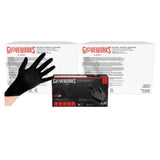 Black nitrile gloves held up in front of a Gloveworks packaging box on a white background